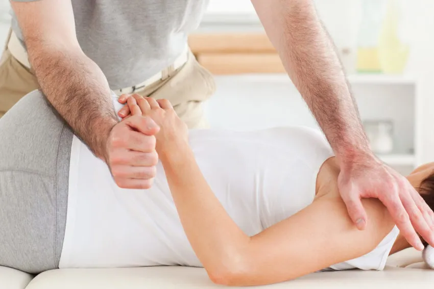 Chiropractor working on a patient's back